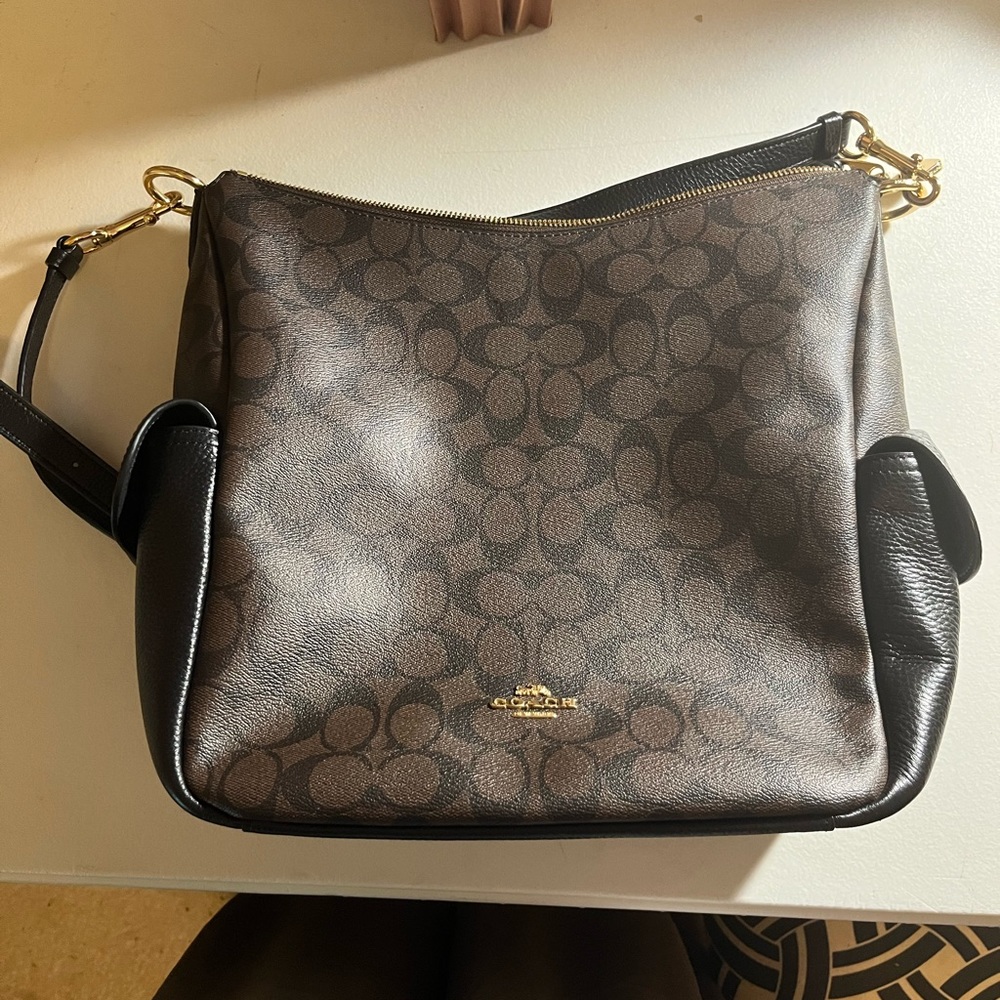 Coach bucket bag with long strap.